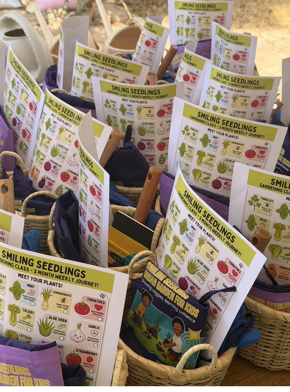 Gift baskets with aprons, tools, and Meet Your Plants learning cards for each child